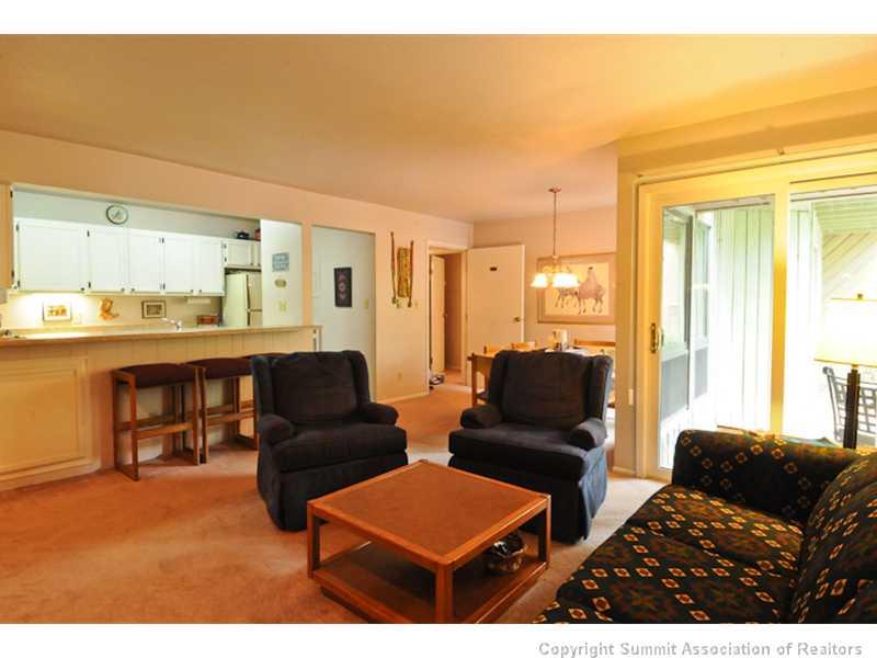 1977 Soda Ridge Road, Unit 1212 Keystone, CO 80435 - Photo 4 of 25 a living room with furniture and a large window