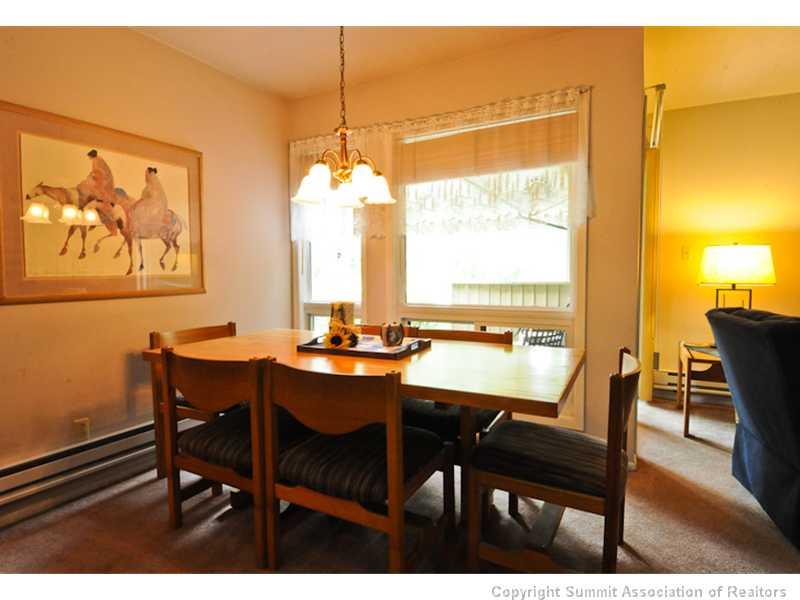 1977 Soda Ridge Road, Unit 1212 Keystone, CO 80435 - Photo 6 of 25 a view of a dining room with furniture window and outside view