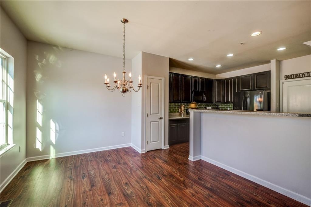 Between the Kitchen and Dining Room features an overhang counter perfect for high top bar stools