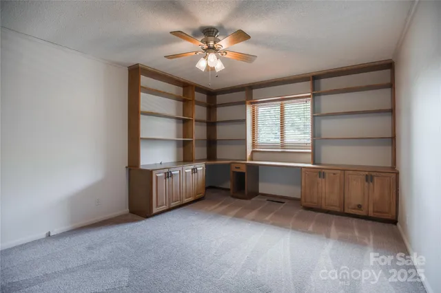 a bathroom with a sink toilet vanity and shower