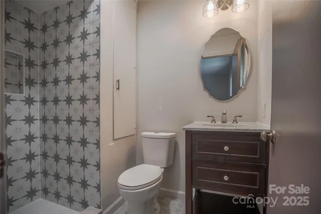 a view of a house with a yard and potted plants
