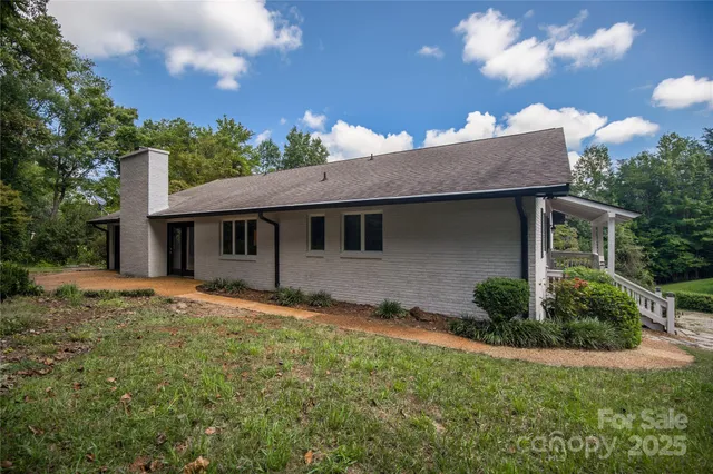 a kitchen with stainless steel appliances granite countertop a refrigerator stove and sink