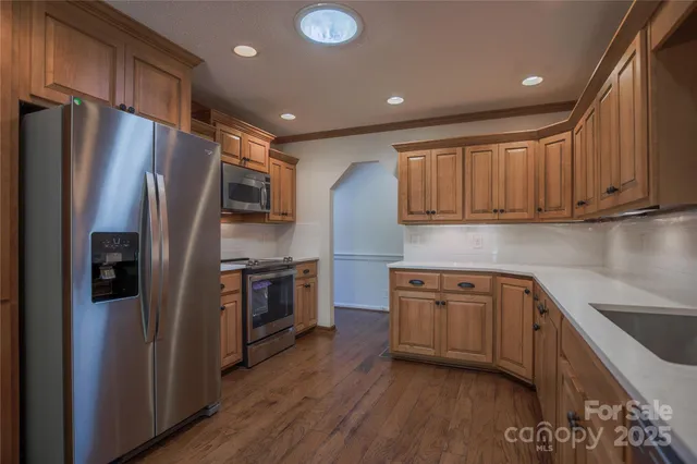 a view of a hallway with a chandelier