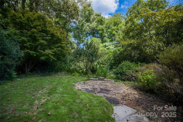 a big yard with lots of green space and deers