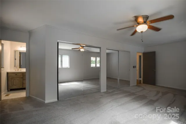a bathroom with a sink toilet and a mirror