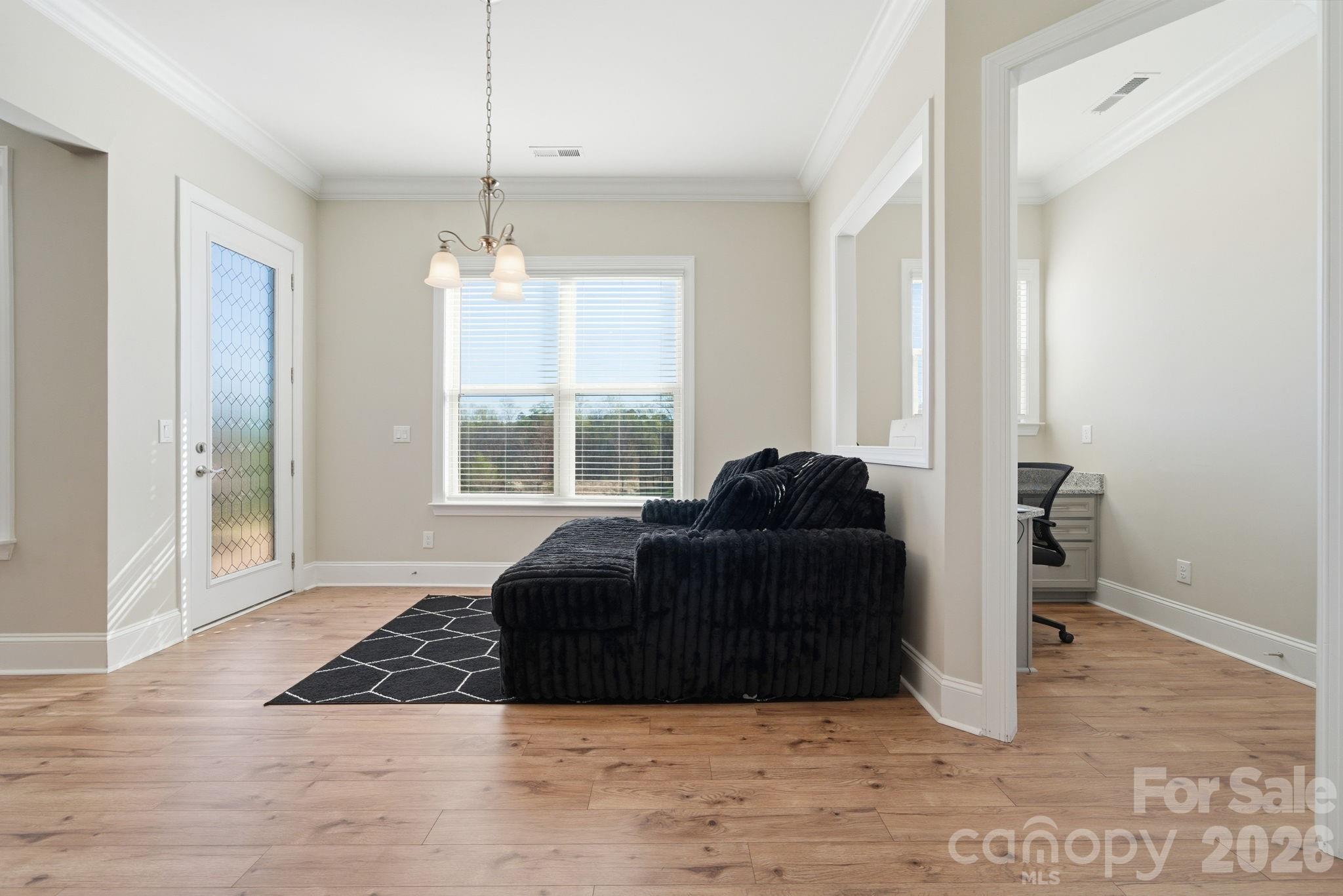 8920 Branch Brook Place Huntersville, NC 28078 - Photo 16 of 41 a living room with a bed furniture and next to a window