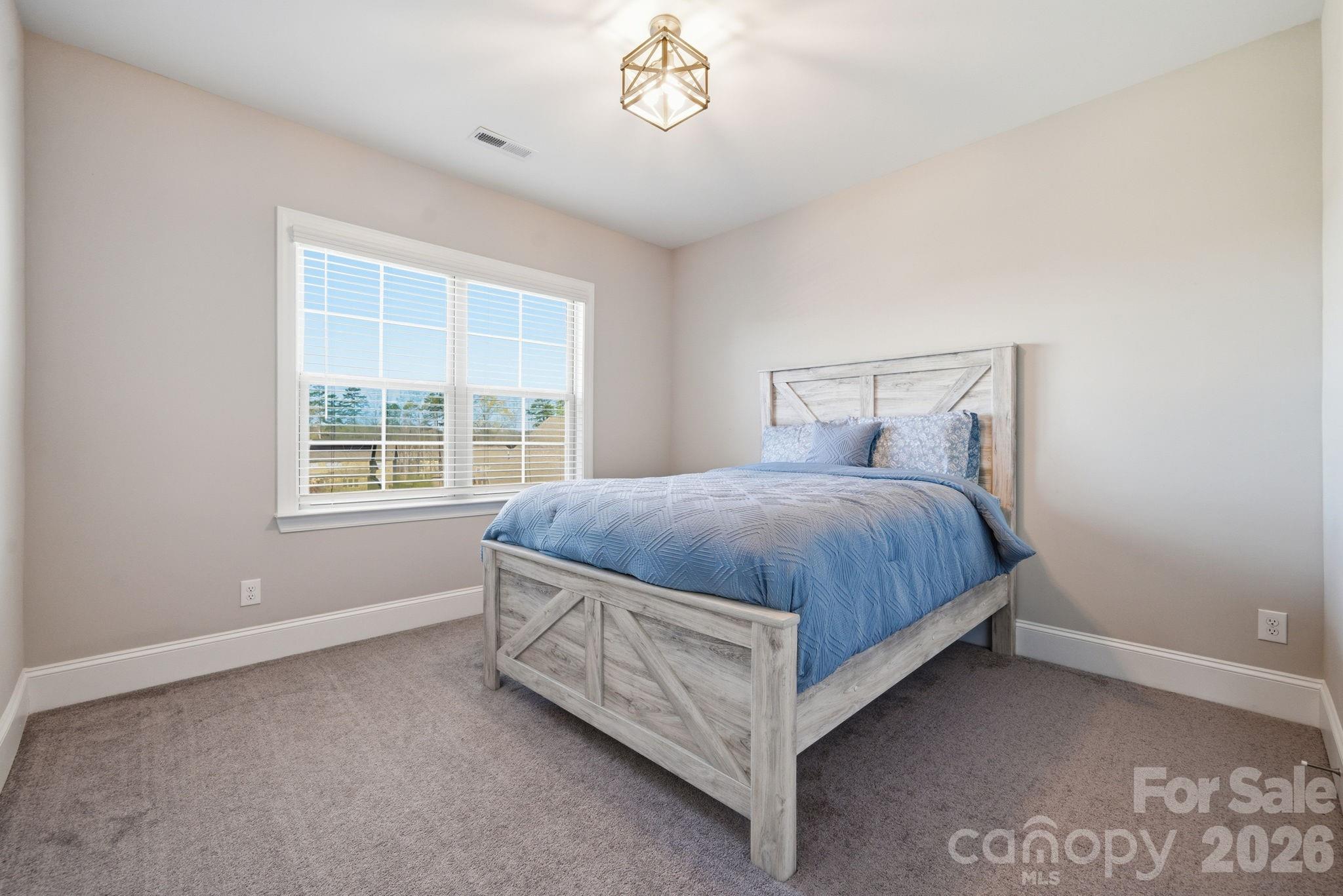 8920 Branch Brook Place Huntersville, NC 28078 - Photo 29 of 41 a bedroom with a bed and a window