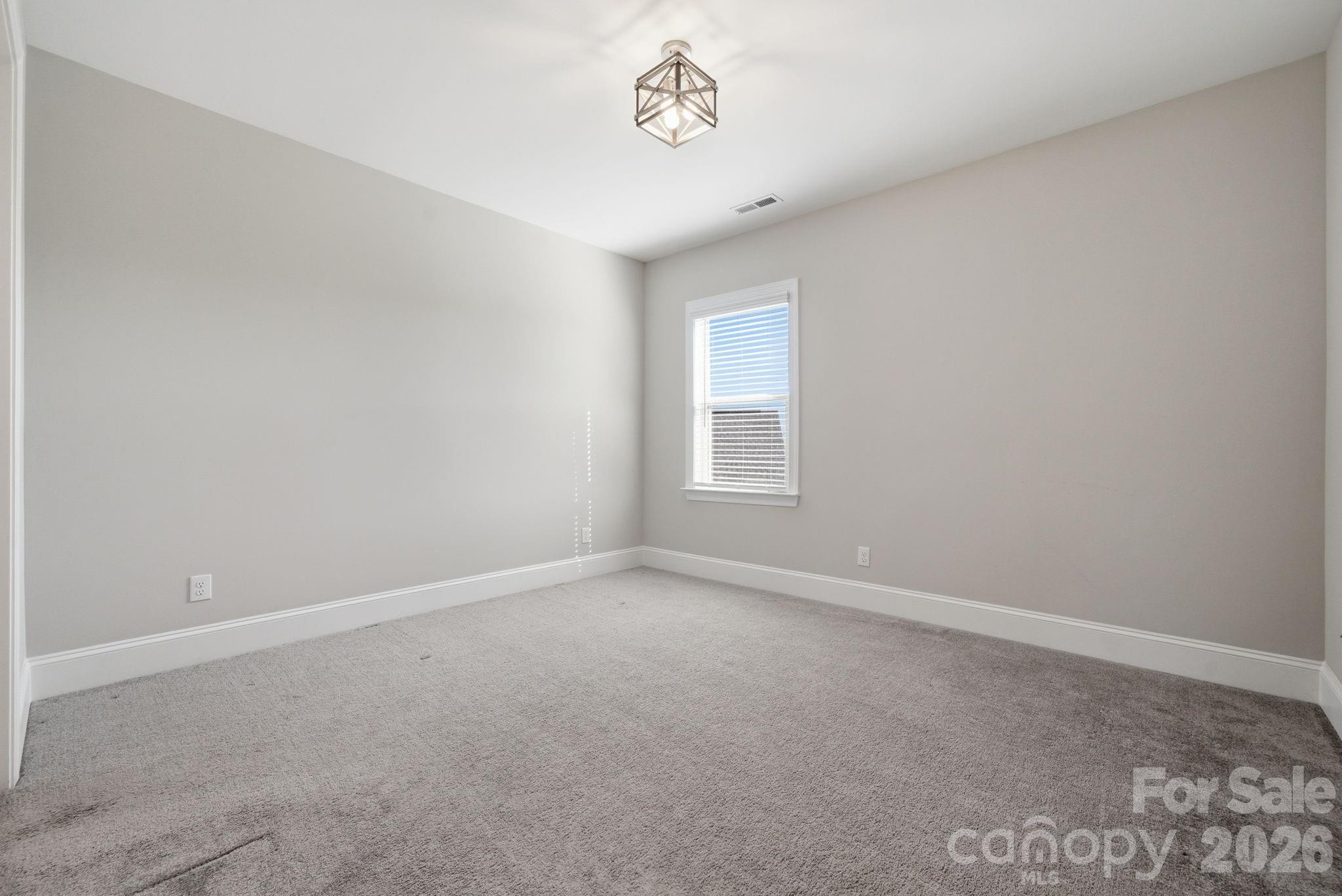 8920 Branch Brook Place Huntersville, NC 28078 - Photo 31 of 41 an empty room with a window