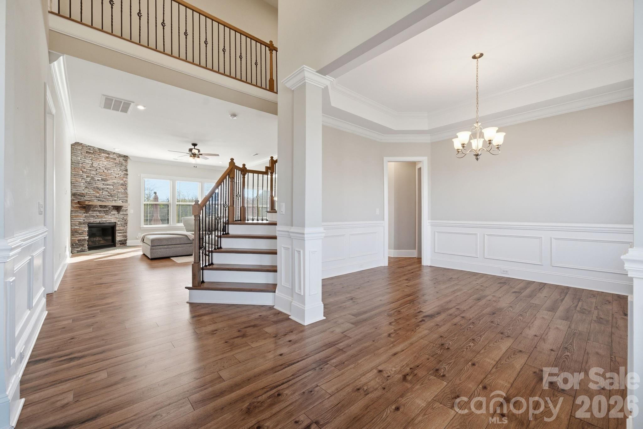 8920 Branch Brook Place Huntersville, NC 28078 - Photo 5 of 41 a view of a hallway view with wooden floor and staircase
