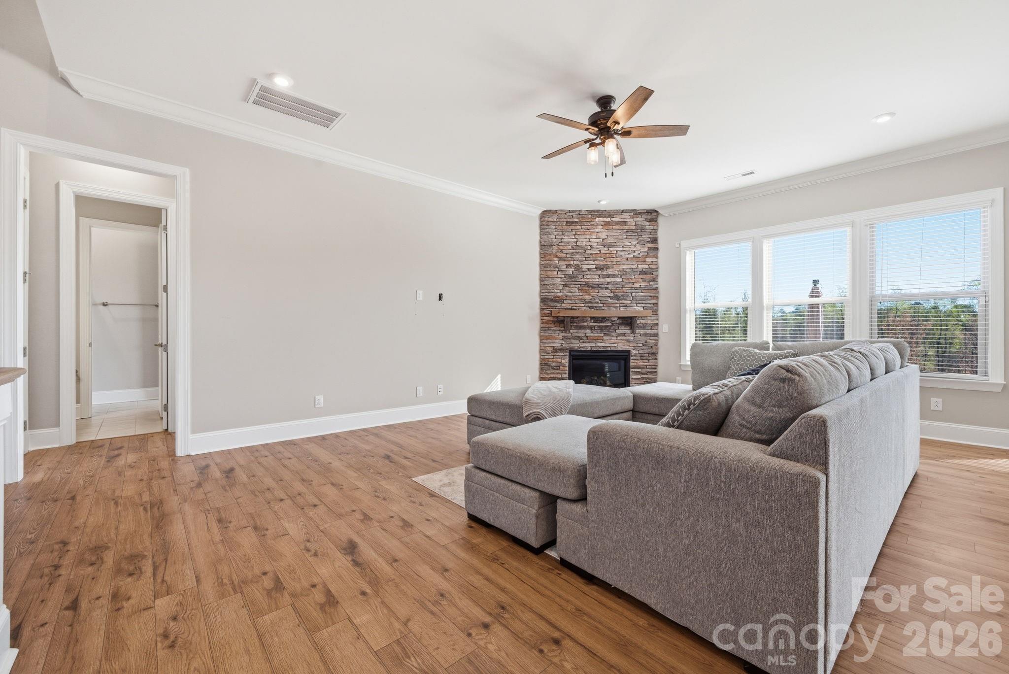 8920 Branch Brook Place Huntersville, NC 28078 - Photo 10 of 41 a living room with furniture and a fireplace