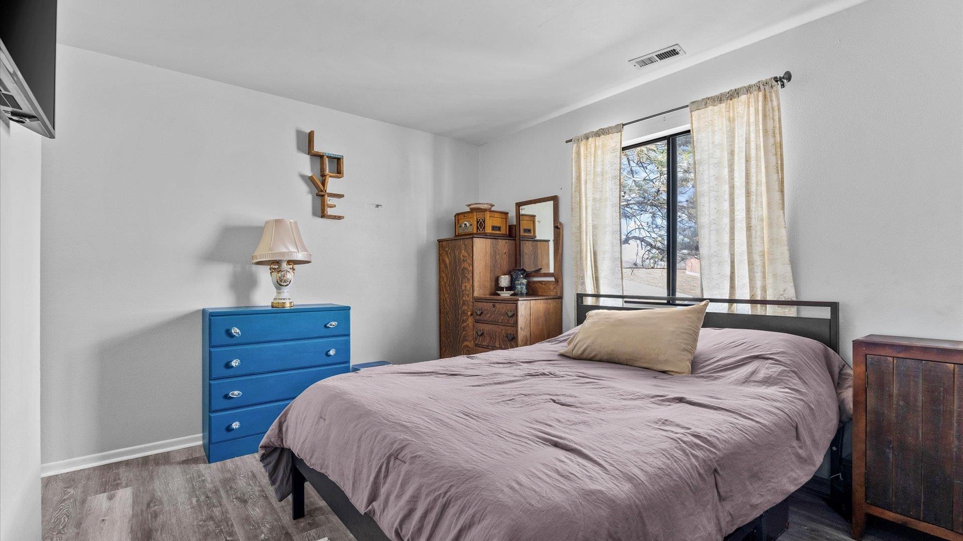 517-28 28 1/2 Road, Unit 4E Grand Junction, CO 81501 - Photo 11 of 15 a bedroom with a bed and a window