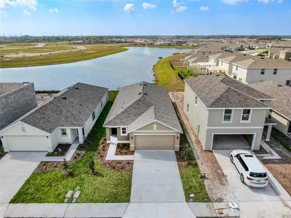 an aerial view of a house with a garden