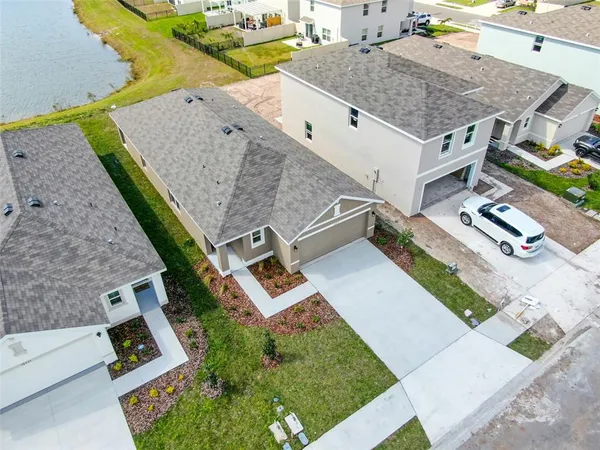 a front view of a house with swimming pool having outdoor seating