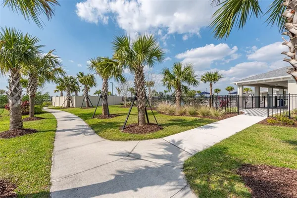 an aerial view of a house a yard swimming pool and outdoor seating