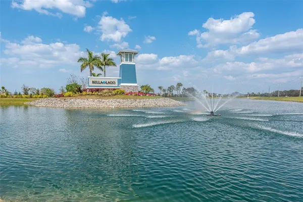 a view of swimming pool with a dining table and chairs