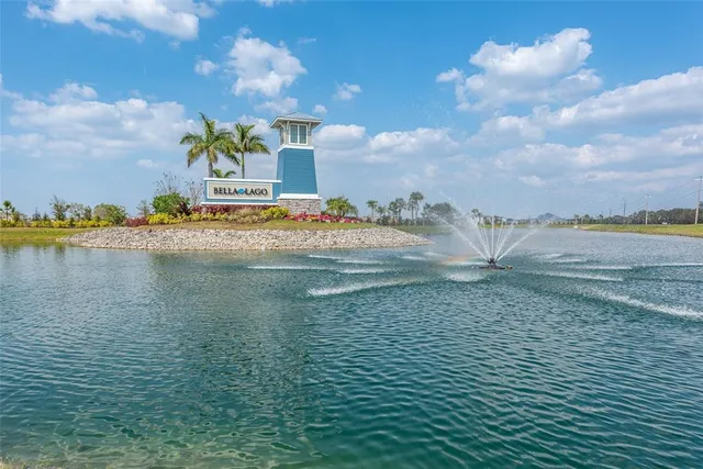 a view of swimming pool with a dining table and chairs