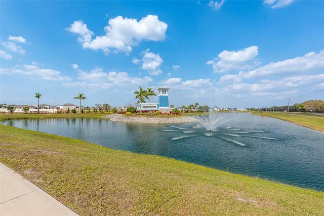 a view of a swimming pool with a dining table and chairs
