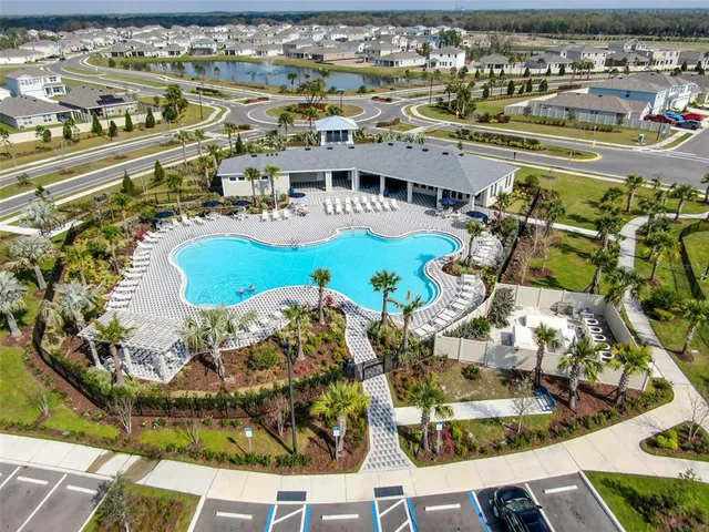 a view of a swimming pool with a patio