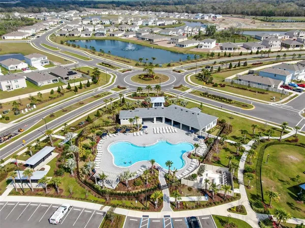 a view of a swimming pool with a table and chairs