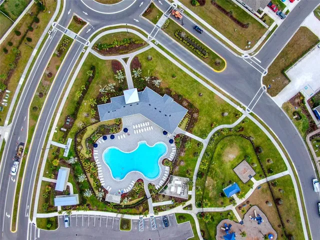 a view of a swimming pool in front of residential buildings