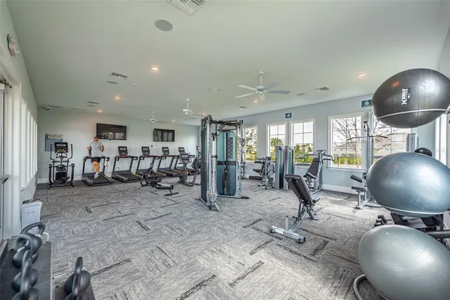 a view of a swimming pool with outdoor seating