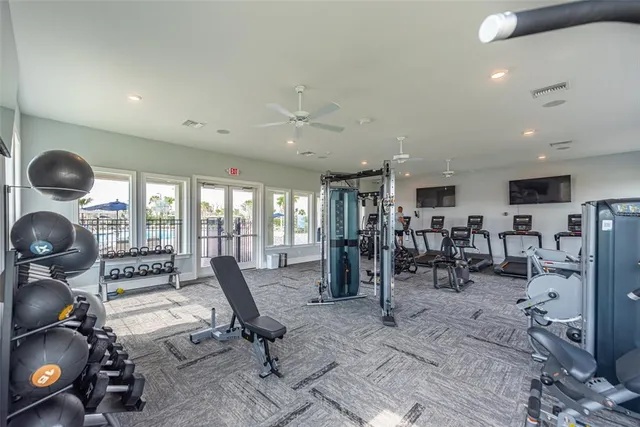 a view of a swimming pool with a table and chairs