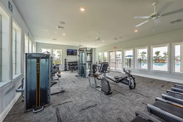 a view of a swimming pool and lake from nearby houses