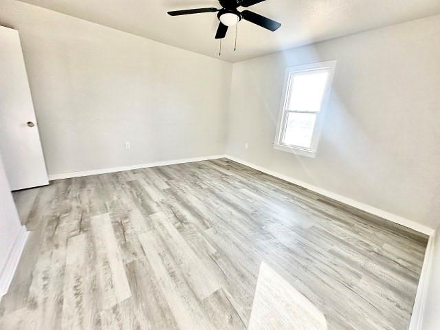 409 SW Avenue East Seminole, TX 79360 - Photo 15 of 16 wooden floor in an empty room