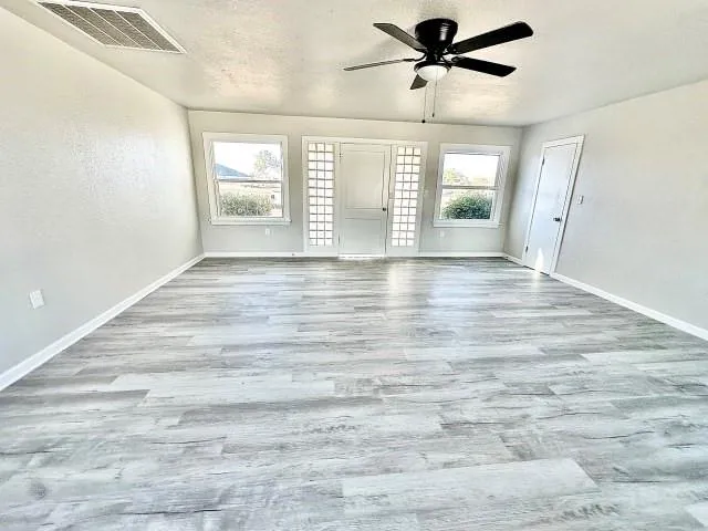 a view of an empty room with a window