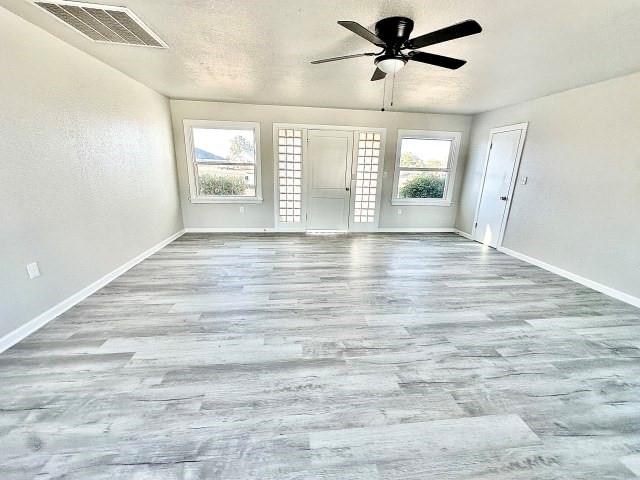 409 SW Avenue East Seminole, TX 79360 - Photo 6 of 16 a view of an empty room with a window