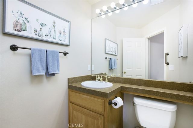 a view of a lake with couches and city view