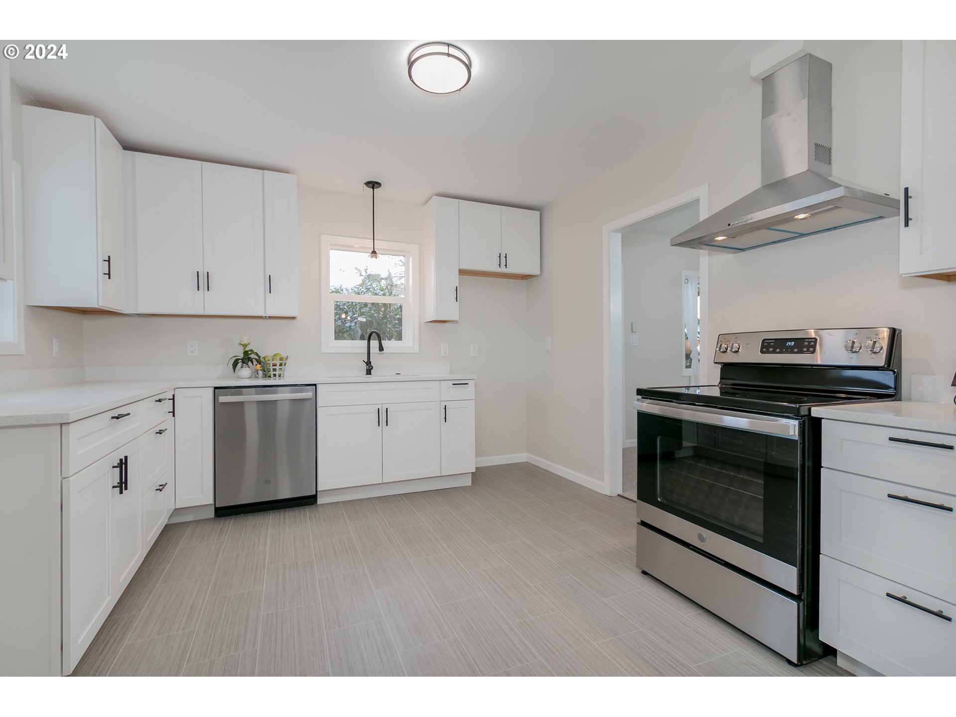 1467 Main Street Springfield, OR 97477 - Photo 13 of 29 a kitchen with cabinets stainless steel appliances and wooden floor