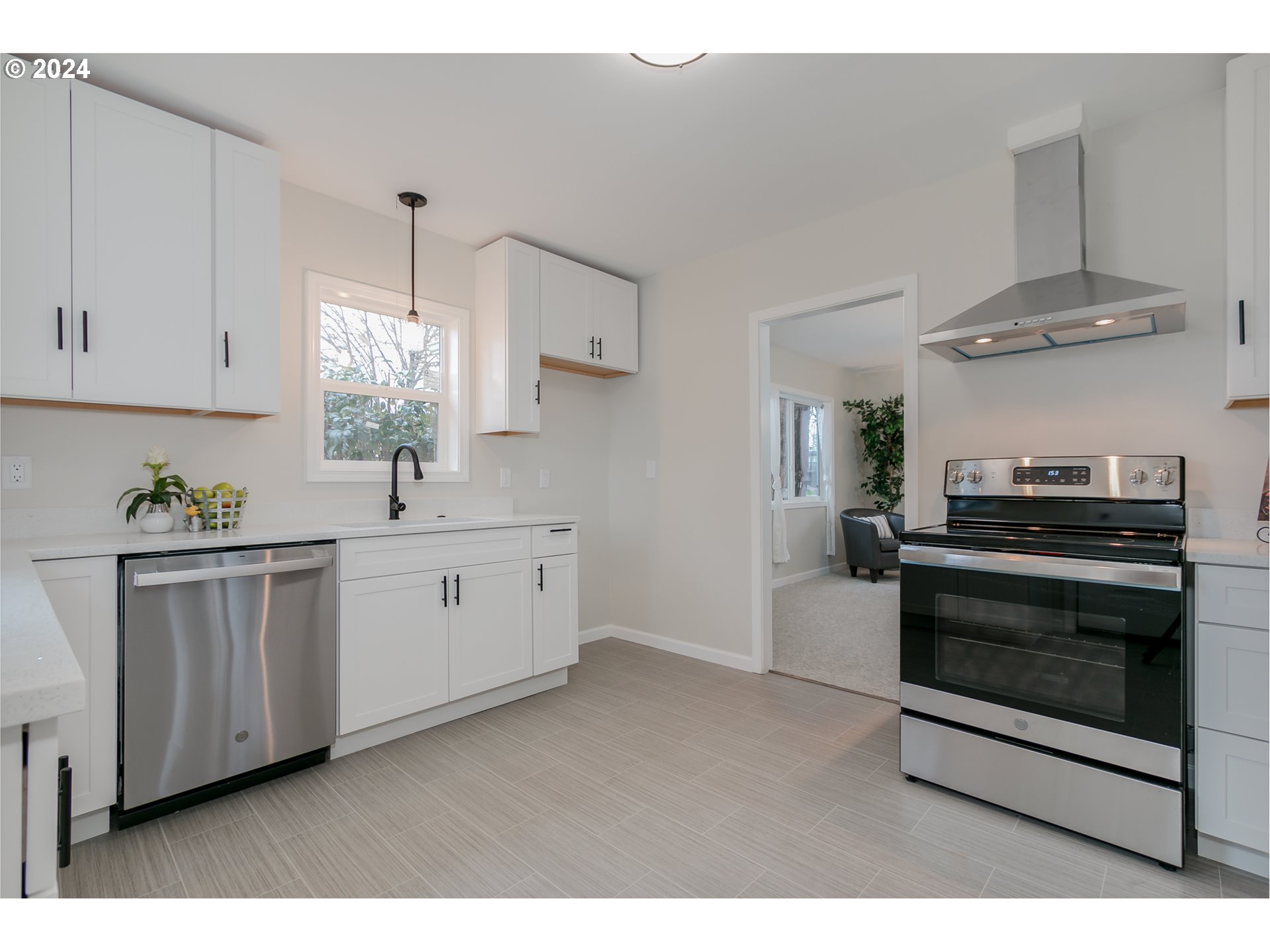 1467 Main Street Springfield, OR 97477 - Photo 14 of 29 a kitchen with stainless steel appliances a sink cabinets and a wooden floor