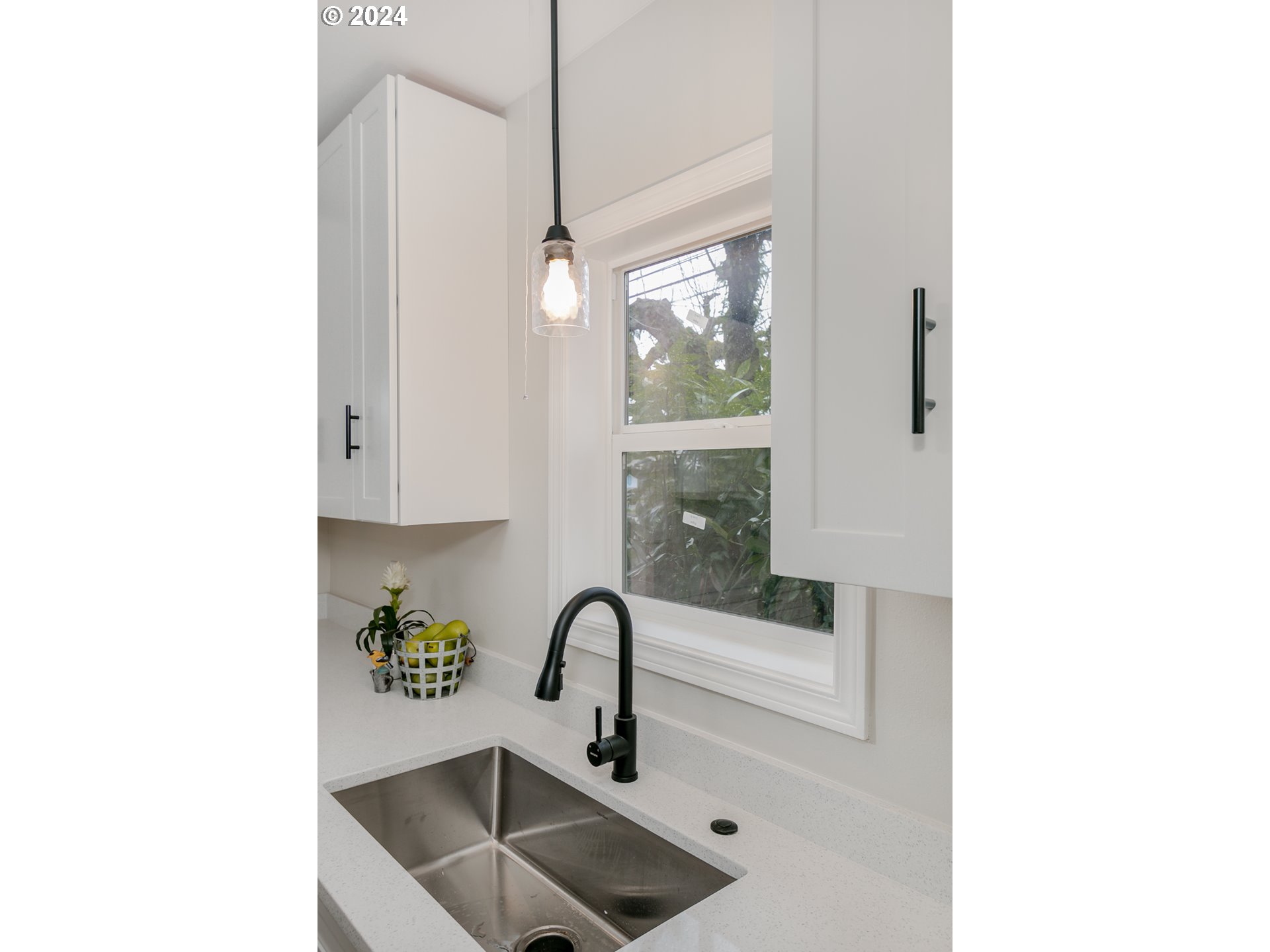 1467 Main Street Springfield, OR 97477 - Photo 16 of 29 a kitchen with a sink and a window