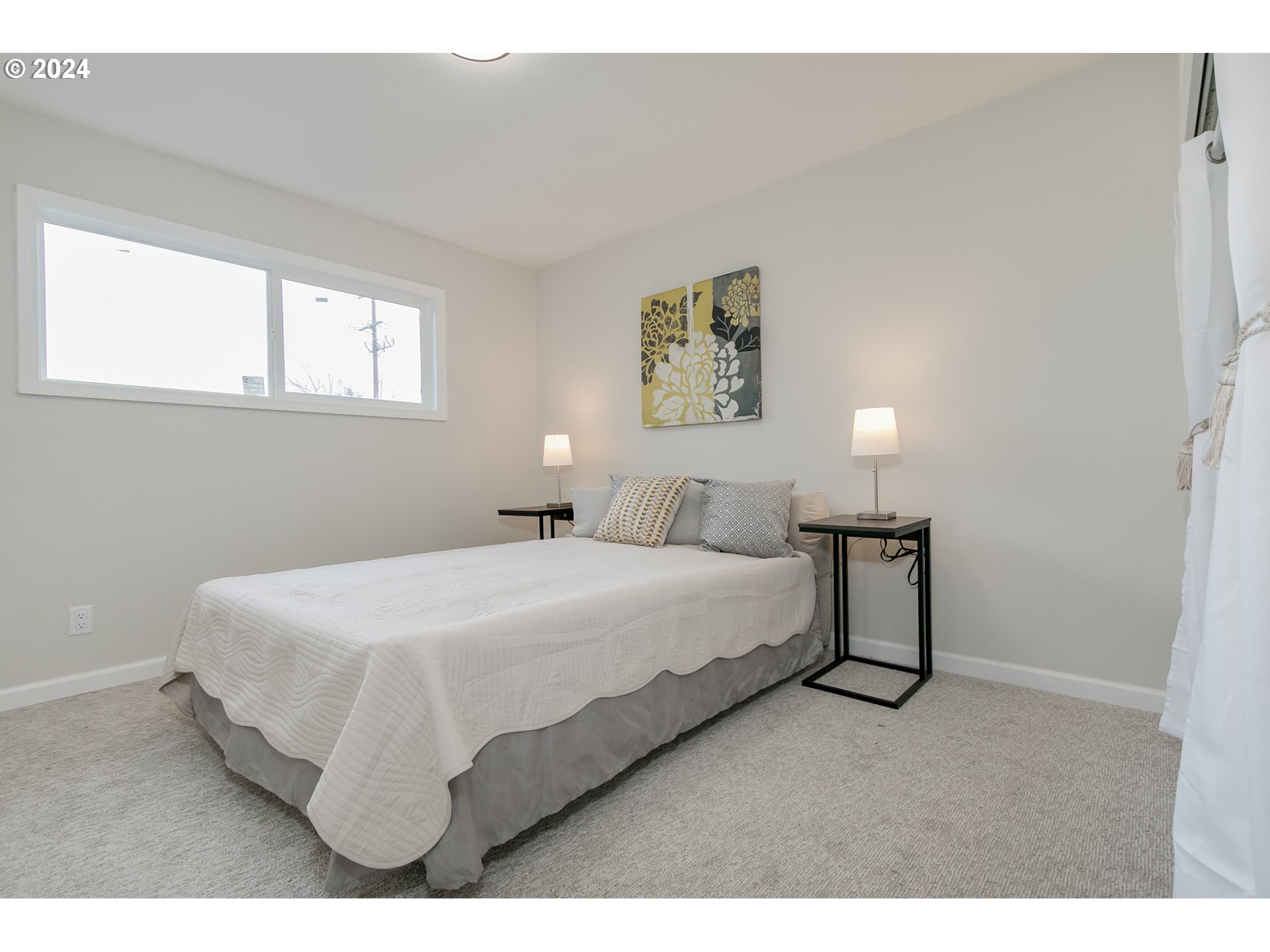 1467 Main Street Springfield, OR 97477 - Photo 20 of 29 a bedroom with a bed and a painting on the wall