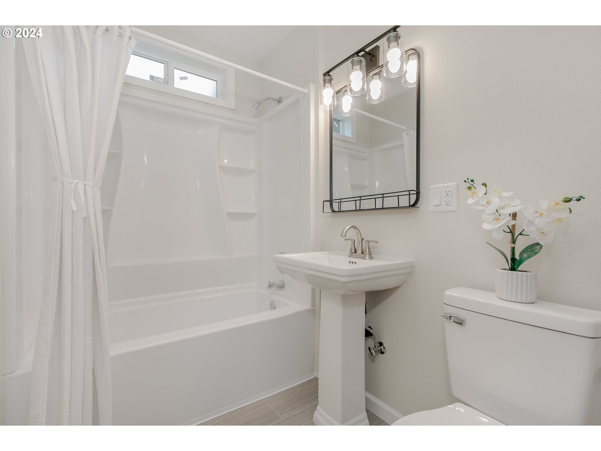 1467 Main Street Springfield, OR 97477 - Photo 21 of 29 a bathroom with a sink mirror toilet and vanity