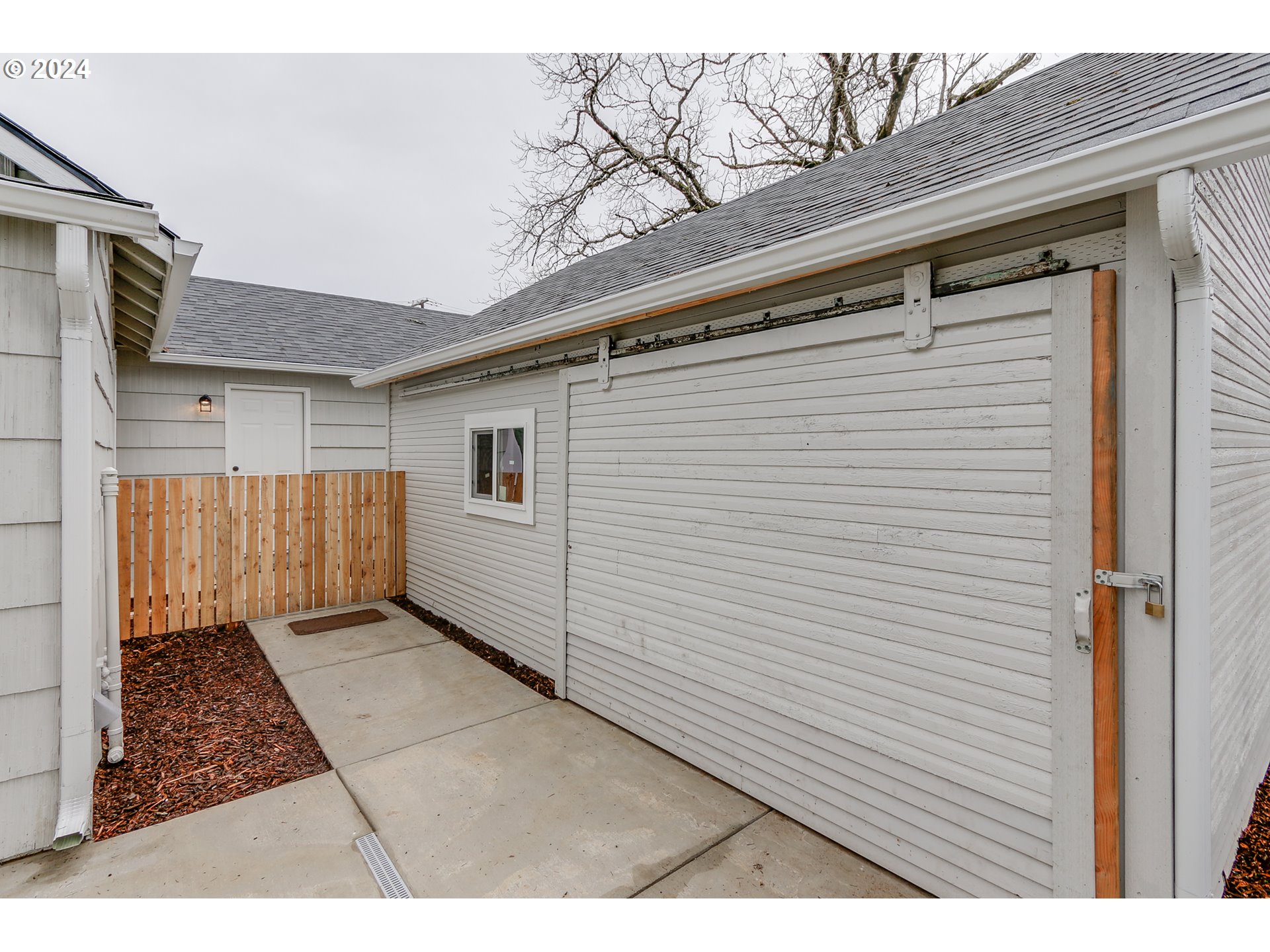 1467 Main Street Springfield, OR 97477 - Photo 24 of 29 a view of a house with a door and wooden bench