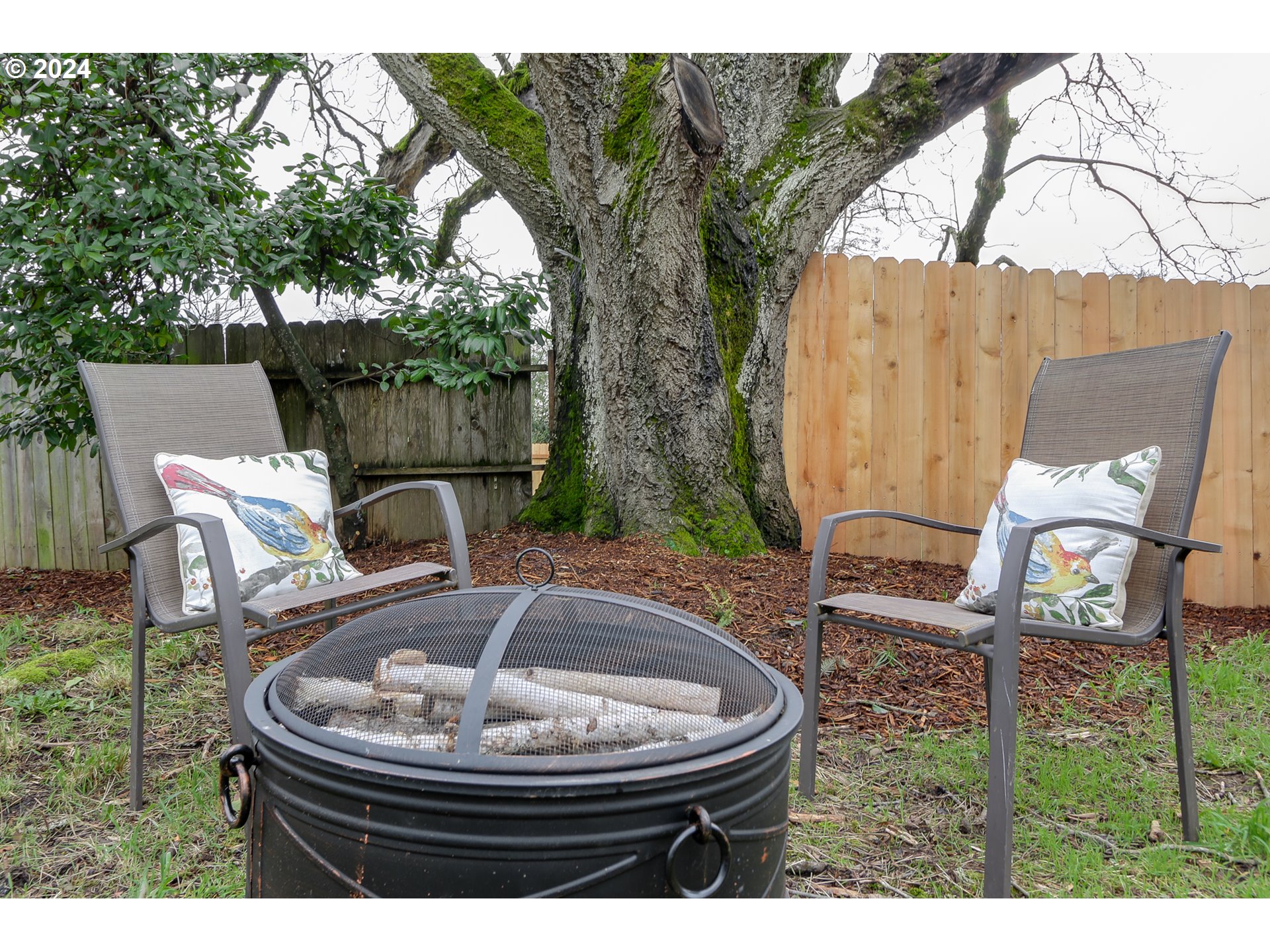 1467 Main Street Springfield, OR 97477 - Photo 27 of 29 a backyard of a house with yard fountain and outdoor seating