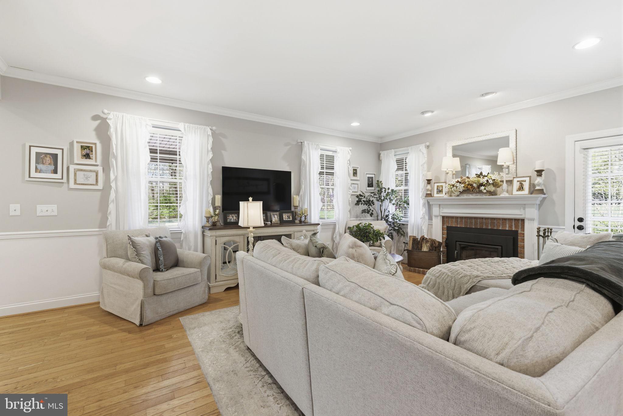 2254 Phillips Mill Road Forest Hill, MD 21050 - Photo 22 of 63 Family room with fireplace & hardwood floors