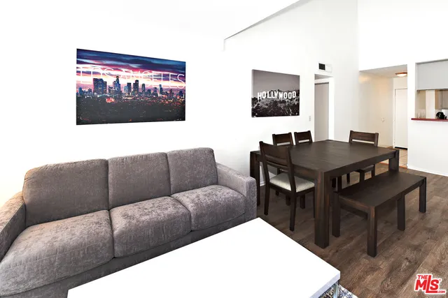 a living room with couches and a table