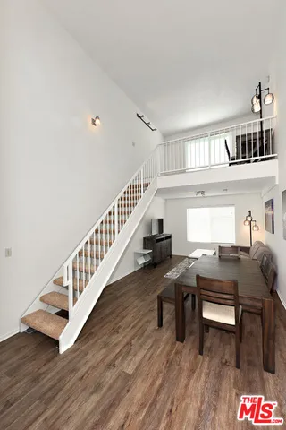 a workspace with furniture and wooden floor