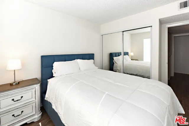 a large white bed in a white room