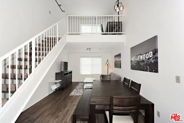 a view of a dining room with furniture window and wooden floor