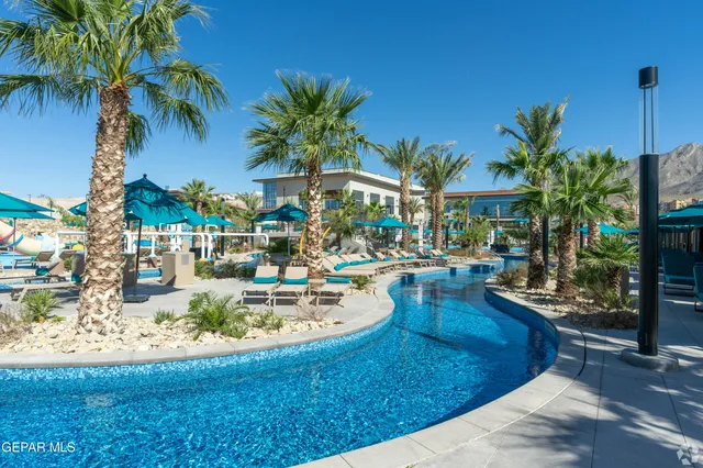 a view of a swimming pool with a patio