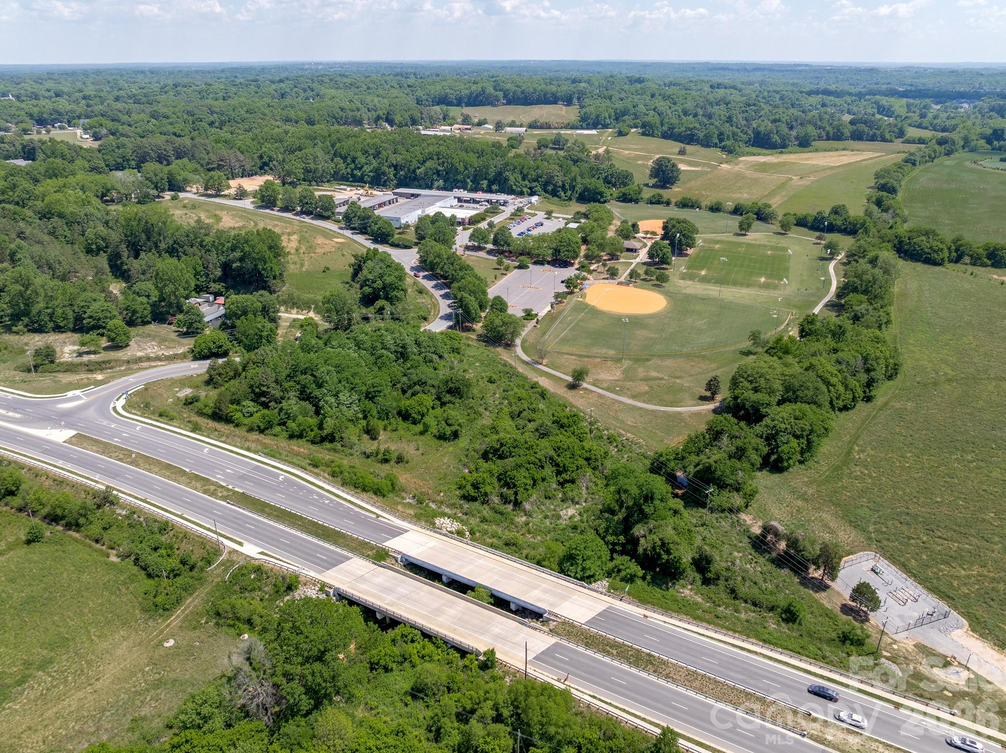 1599 Bethpage Road Kannapolis, NC 28081 - Photo 4 of 13 an aerial view of a house with a yard and lake view