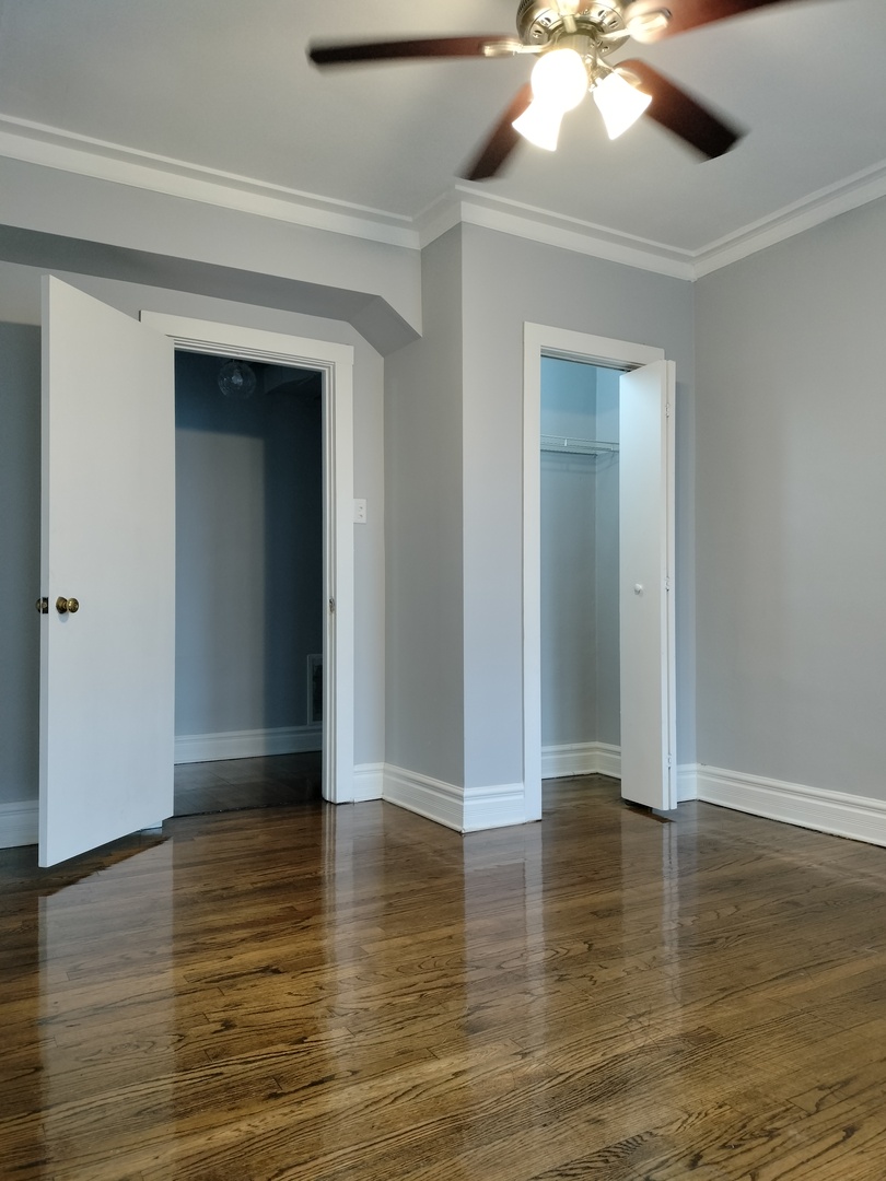 1739 West 80th Street, Unit 17933 Chicago, IL 60620 - Photo 16 of 17 a view of an empty room with wooden floor