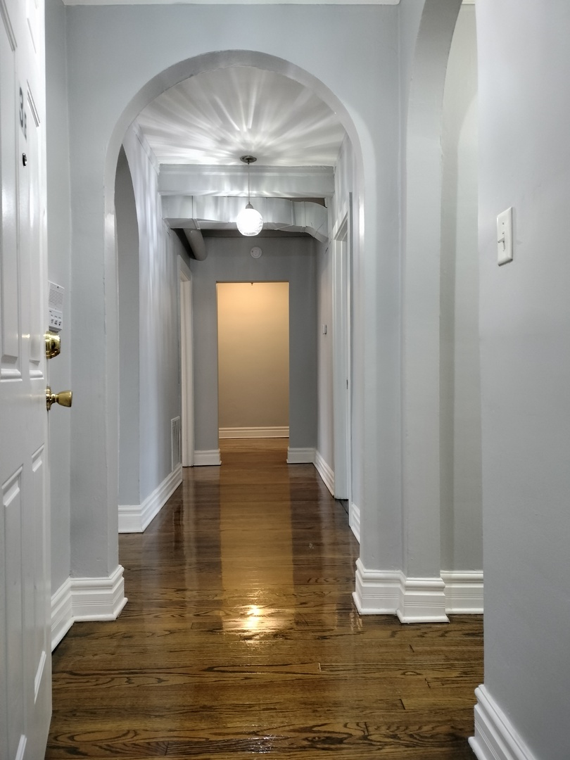 1739 West 80th Street, Unit 17933 Chicago, IL 60620 - Photo 2 of 17 a view of a hallway with wooden floor