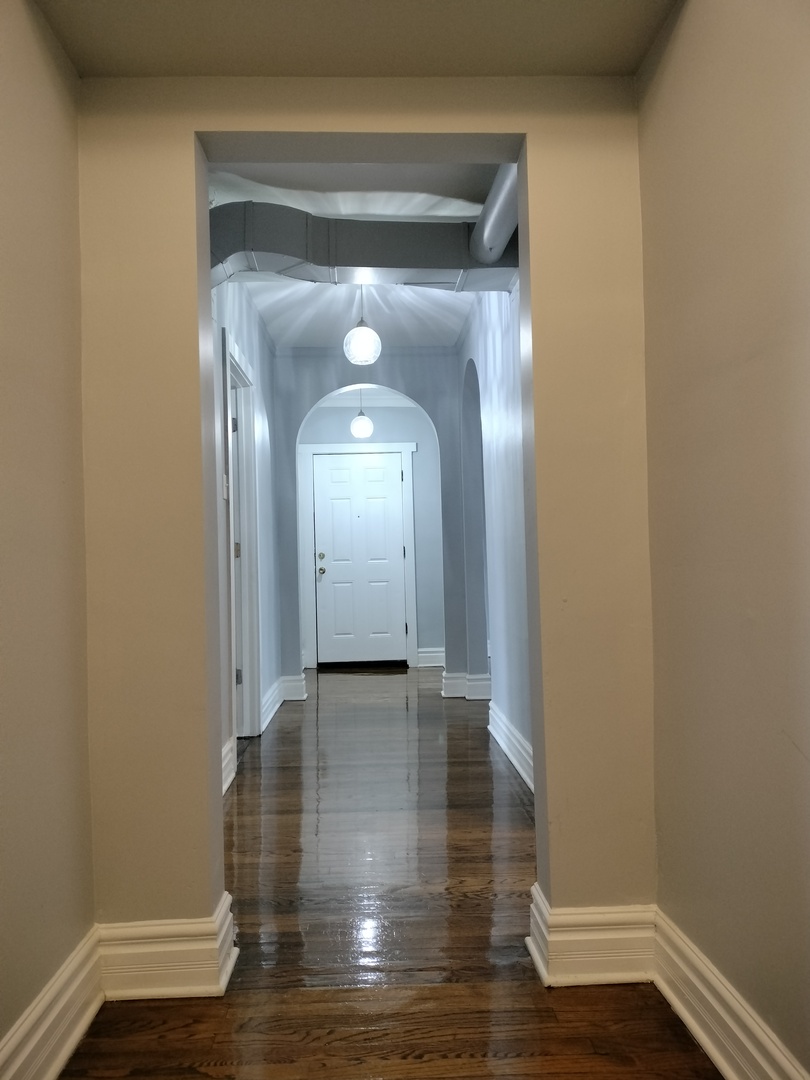 1739 West 80th Street, Unit 17933 Chicago, IL 60620 - Photo 8 of 17 a view of a room with wooden floor