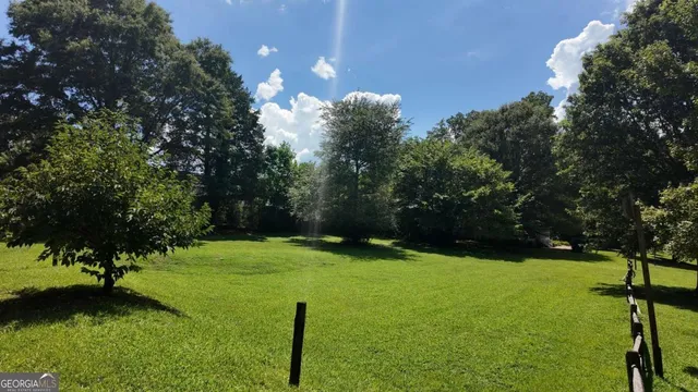 a backyard of a house with lots of green space