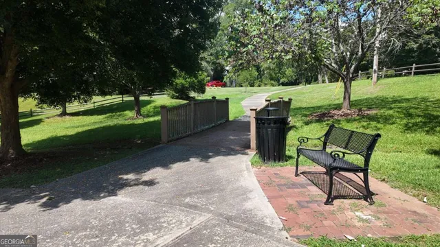 a view of a backyard with sitting area